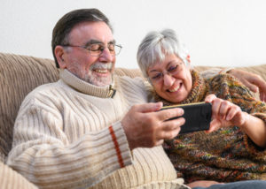 older couple looking at smart phone