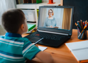 child looking at computer screen